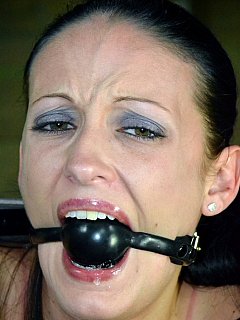 Ring gagged young lady is fully exposed in bondage: you can enjoy every detail of her sexy body