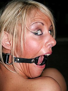 Ring-gagged slut is tied with rope, wrapped in plastic, blindfolded with tape and kept inside the fridge