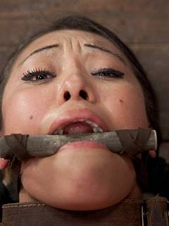 Asian beauty is in bondage and got stuff put in her pussy and attached to her tits