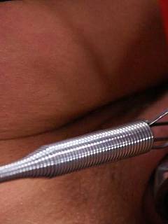 Mature lesbian is having her pussy stitched up by using steel clamps from a staple gun