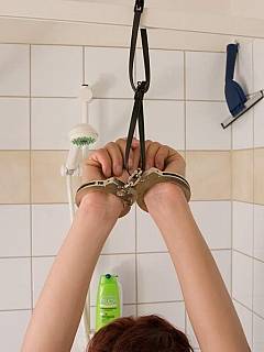 Amateur Sandra is handcuffed and gagged helself in the bathroom