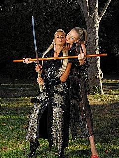 Girls having a sword fight where the loser has to be fucked with the wooden stick