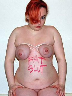 Naked fattie is holding a message in her hands that says that she is worthless fuck pig