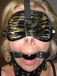 Someone's wife is a big fun of steel bondage: enjoy her blindfolded and gagged pictures