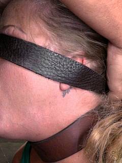 Blindfolded MILF is working out cock on her knees and cuffed