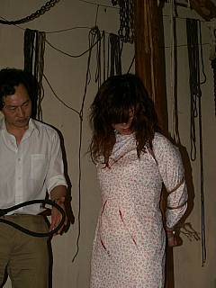 Ultimately cruel interrogation where bondaged asian woman is being beaten with the bullwhip
