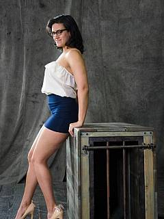 Freshly bandaged woman is posing in ropes with remains of her clothes still covering some parts of her body