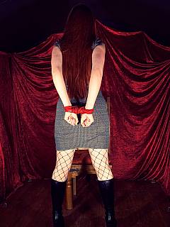 Redhead shows off the very basin hands-behind-the-back tie