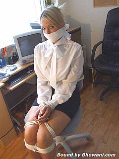 Secretary keeps it quiet and not moving after intruder bandaged and gagged her with a scarf