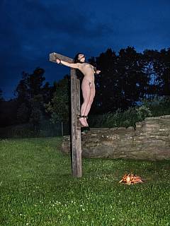 Nude girl was crucified out in the field after being tormented with bondage for an entire day