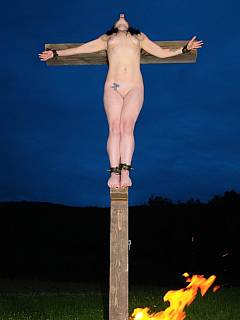 Nude girl was crucified out in the field after being tormented with bondage for an entire day