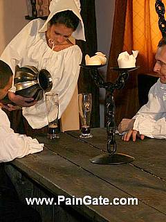 XVII century punishment tavern is spread-bound and whipped for serving food not quick enough