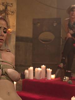 Lesbian Halloween-inspired storyline where dominatrix is using bandaged slavegirl to cast magic spells