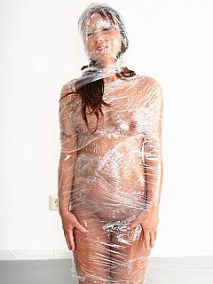 Pictures if nude kneeling girl wrapped in plastic