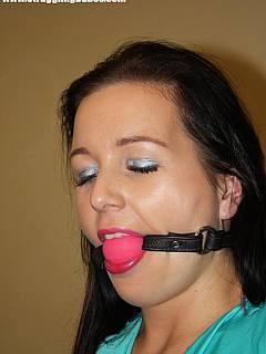 Classic chair tie for the hot brunette in black jeans: gag fits inher mouth perfectly