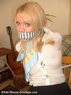 Office mates are in front of each other: wearing white blouses, chair-tied and cleave gagged
