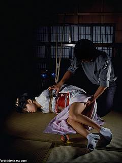 Subgirl in traditional Japan outfit is rolling on the floor all roped and teased sexually