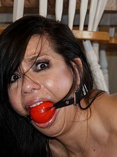 Semi-naked housewife is left bound and gagged: has no ideas about the ways of escaping her restraints