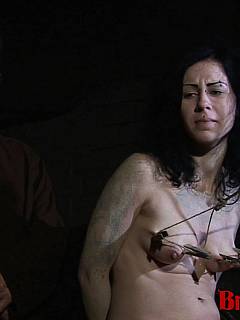 Naked gal is kept in the dark basement and interrogated with extreme nipple pulling