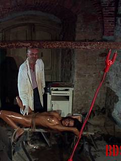Captive woman is in hands of crazy doctor: tied up to the table and violated with bizarre electrified tools in her pussy