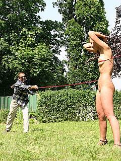 Cheating wife is leashed wit the rope and dragged out to the field with harsh wgip lashes