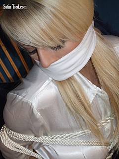 Yet another busty babe is white satin blouse cannot move because of bondage and cannot speak because of cloth gag