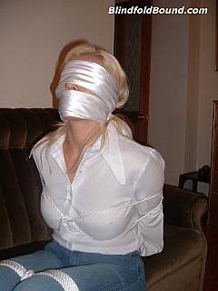 You can unbutton white blouse and enjoy a pair of exposed tits while blond is in bondage, gagged and blindfolded