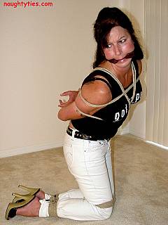 MILF is showing how bondage elegance look posing in sexy white jeans and high heel shoes
