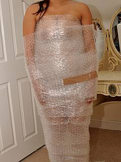 Latin babe thinks it is fun to be wrapped up into packaging plastic tape