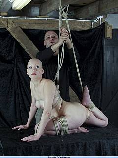 Bald oriental woman is put in ropes naked: prepared for Japanese bondage suspension