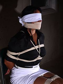 Woman is helpless because of bondage plus cannot make sounds or see because of the cloth gag and blindfold