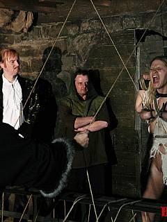 Bizarre medieval interrogation shows girl's tits are getting crushed with crazy iron devices