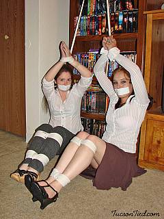Teen mates are loving being tied up together and have sticky tape gags over their mouths