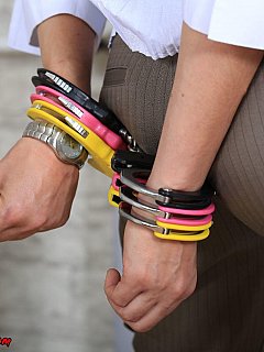 Office lady got three sets of cuffs placed over het wrists and a spread-bar in between her legs