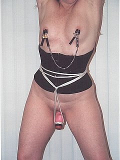 MILF stretched in a series of bondage poses and there is a vibrating toy plugged into her lovely hole