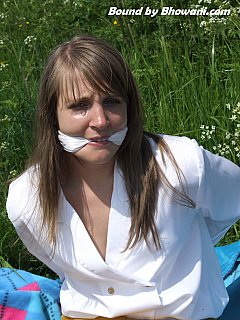 Girl was having a picnic put in the field and some pervert tied her up and gagged