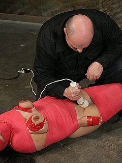 Mumification bondage and painful BDSM tools in action