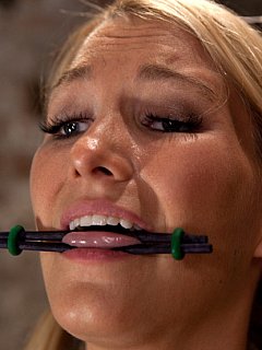 Impaled with a huge dildo w/vibrator stuck right on her clit