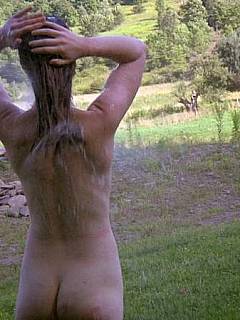 Wet girl is taken outdoors for a nice and firm whipping humiliation