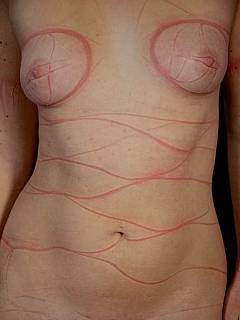 Naked girl is tied up with thin rope that leaves nasty marks on her skin