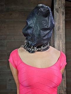 Hot girl is hogtied with handcuffs while there is a leather mask put over her head; getting spread-eagled naked later