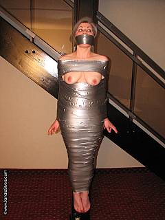 Full body duct tape MILF mummification with only her tits left visible