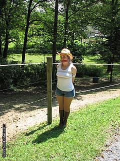 Cowgirl in put in ropes at the farm