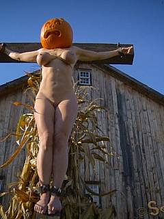 Halloween BDSM spirit: MILF was crucified and had pumpkin over her head, then slut was tied to chair and fucked violently