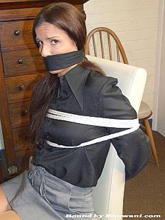 Yet another secretary in her office cannot vove, speak or see because of bondage, blindfold and scarf gag