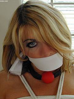 Intruders put busty housewife in bondage and then replaced the ball gag in her mouth with the cleave gag