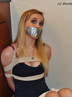 Young secretary wasn't expecting yet another visitor to put her in rope bondage and tape her mouth