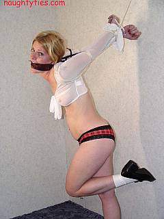 Tormenting next-door girl with the tight strappado and a gag in her mouth
