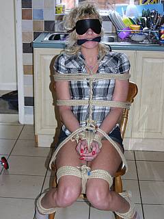 Next-door housewife seems to be pleased with the rope bondage she was put in at the kitchen