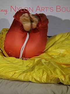 Hogtied woman is raincoat manages to escape the rope hogtie she was put into